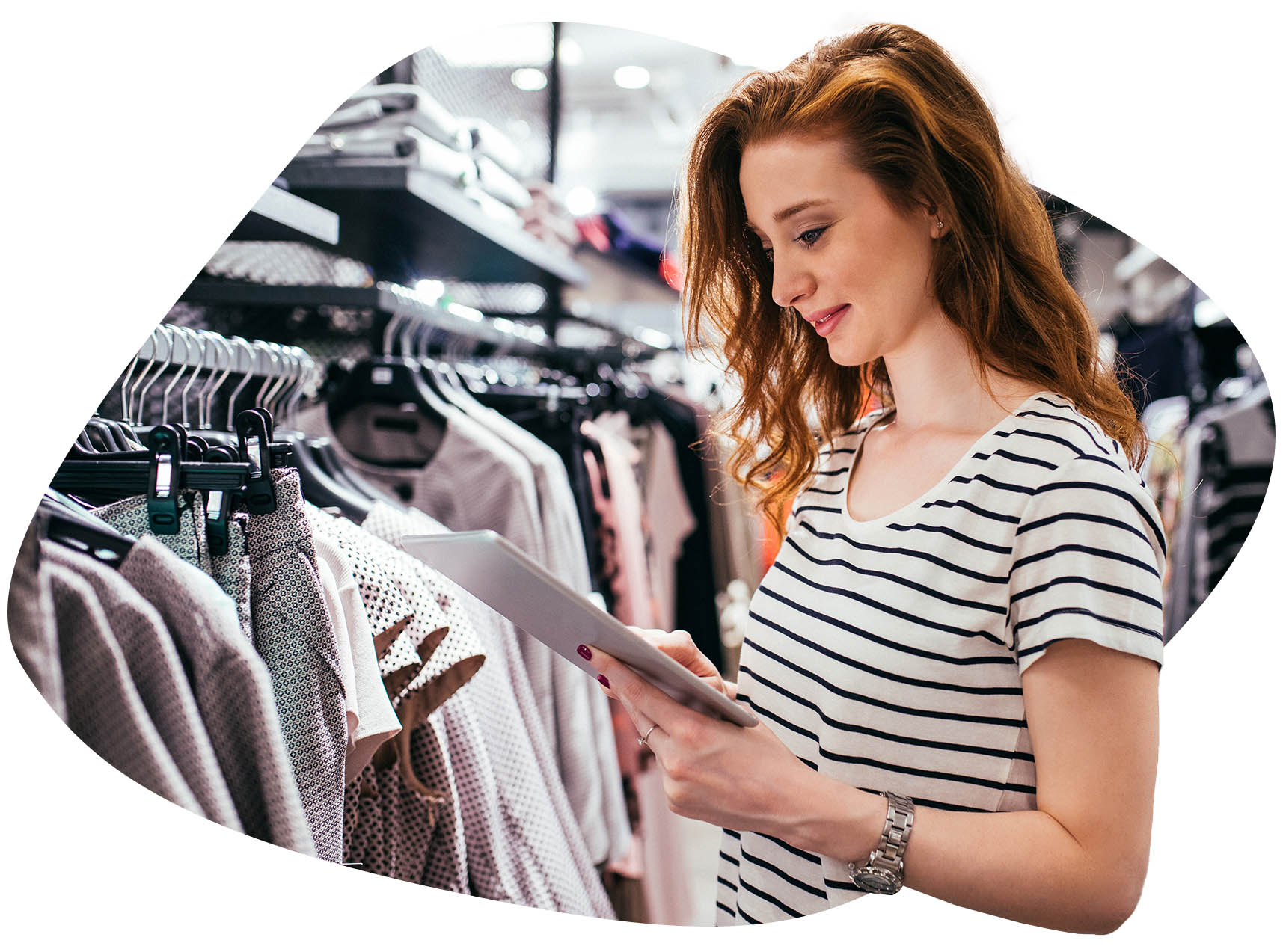 Woman looking at an ipad, in a textil shop